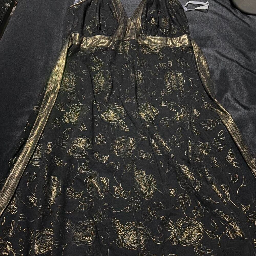 black and gold metallic floral print dress featuring a plunging halter neckline